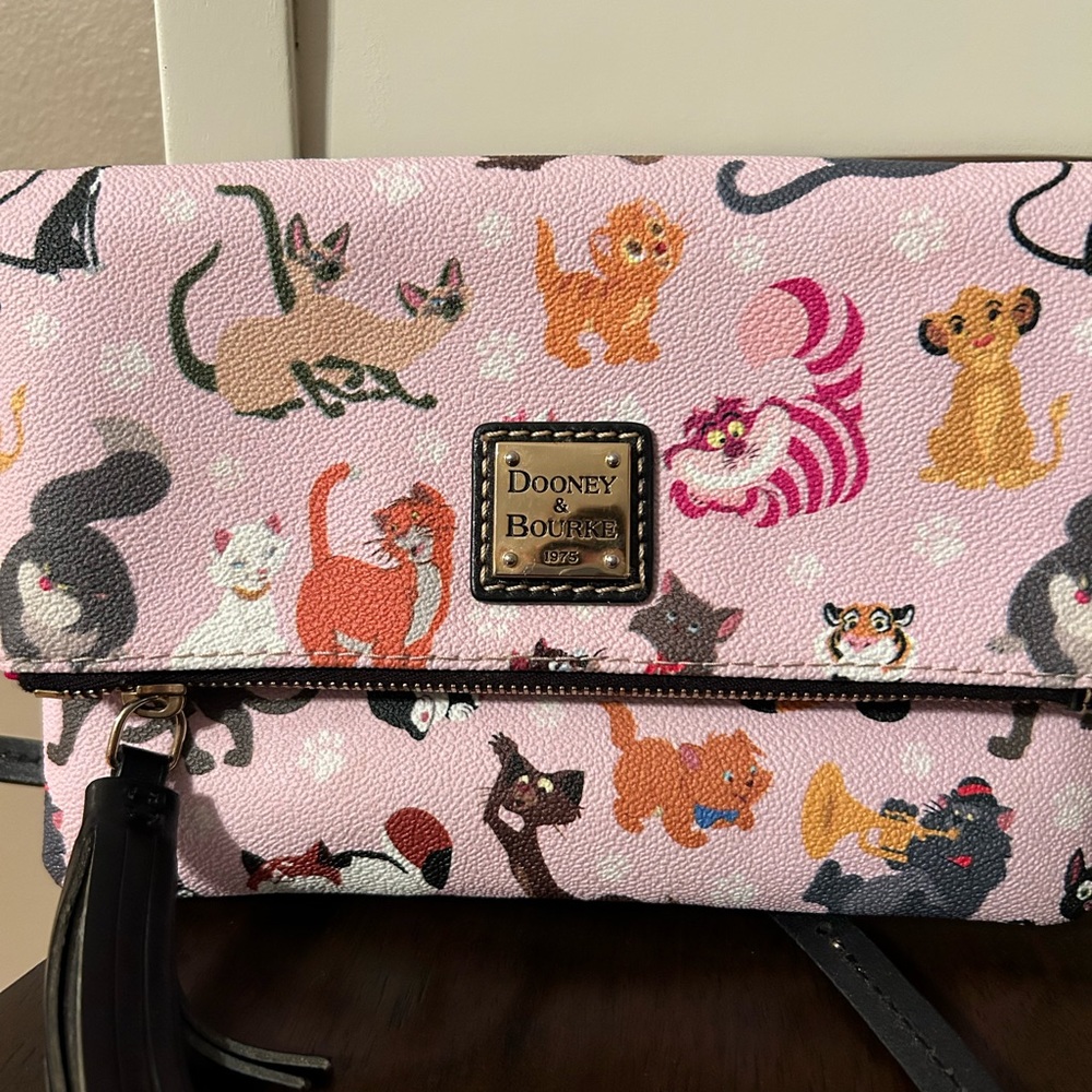Dooney and Bourke fold over crossbody featuring Disney cats.